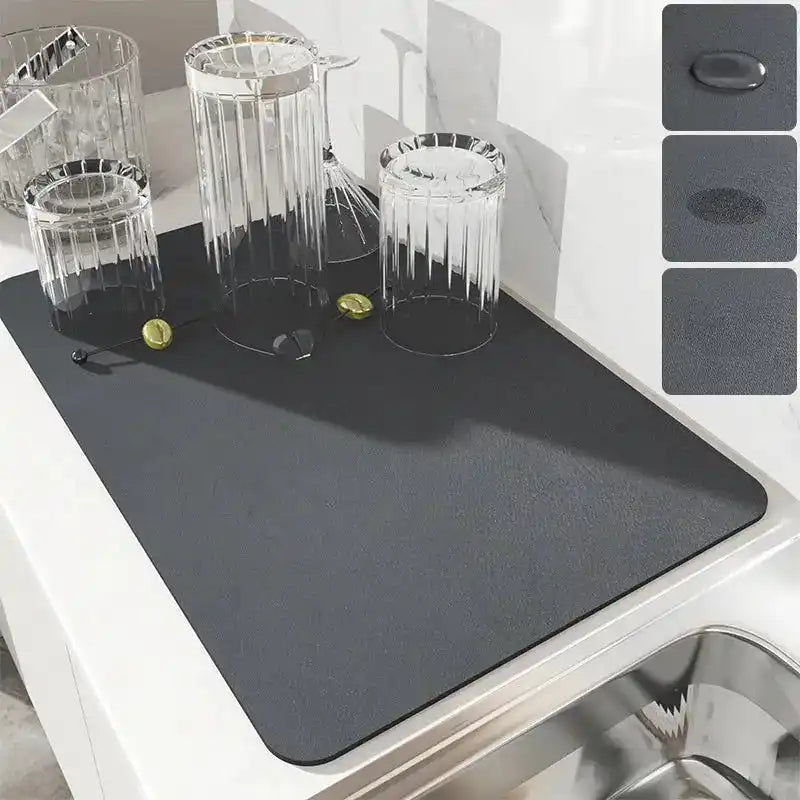 Dark gray silicone drying mat for dishes and kitchenware.