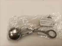 Metal ball gag in clear plastic packaging.