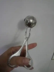 Metal ice cream scoop with a trigger mechanism.