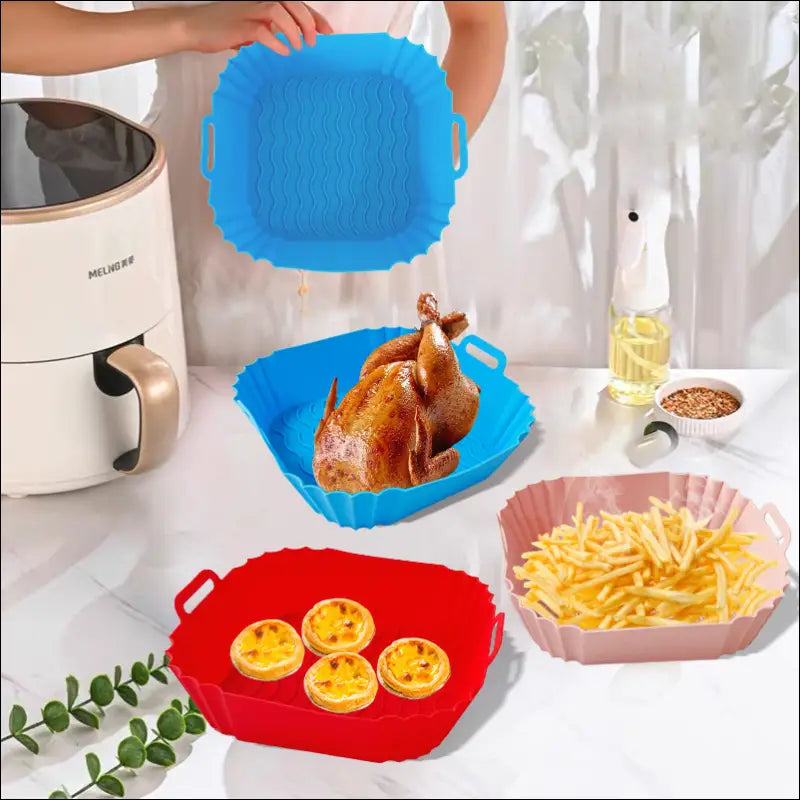 Bright blue and red square silicone air fryer trays with handles for effortless cooking