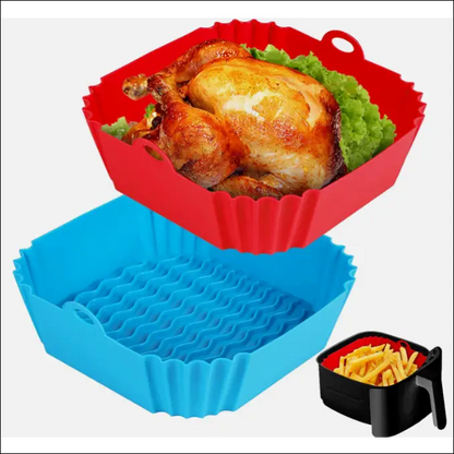 Roasted chicken in a square silicone air fryer tray with fresh lettuce leaves