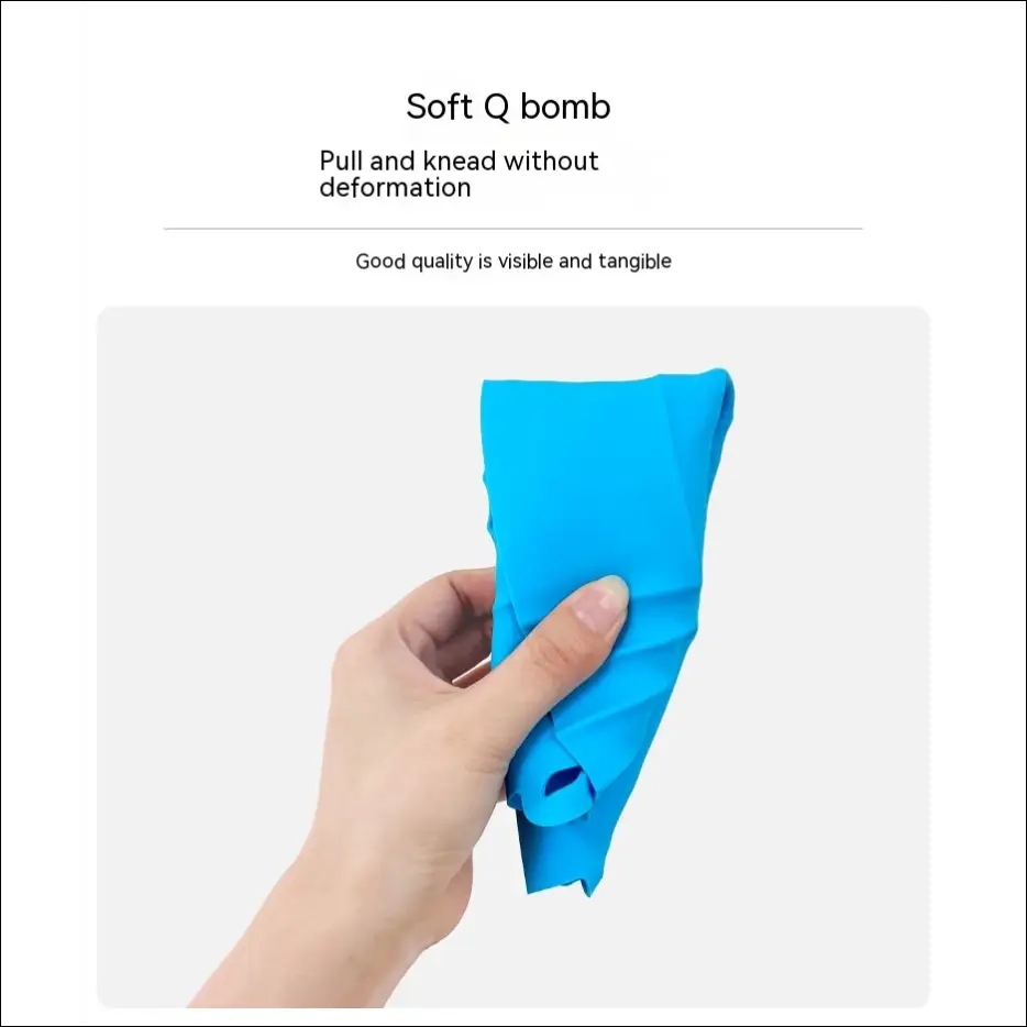 Bright blue square silicone air fryer tray being stretched by a hand for easy use