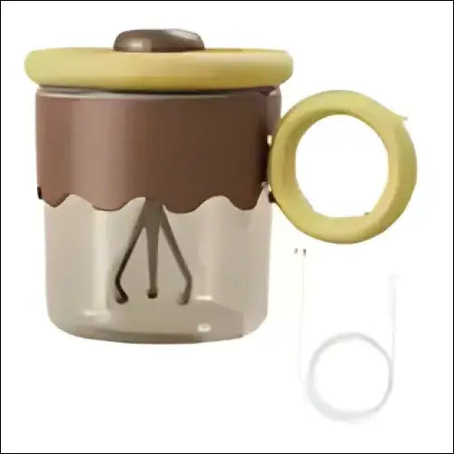 Brown and beige ceramic TurboMix Magic Mug featuring yellow handle and whisk design